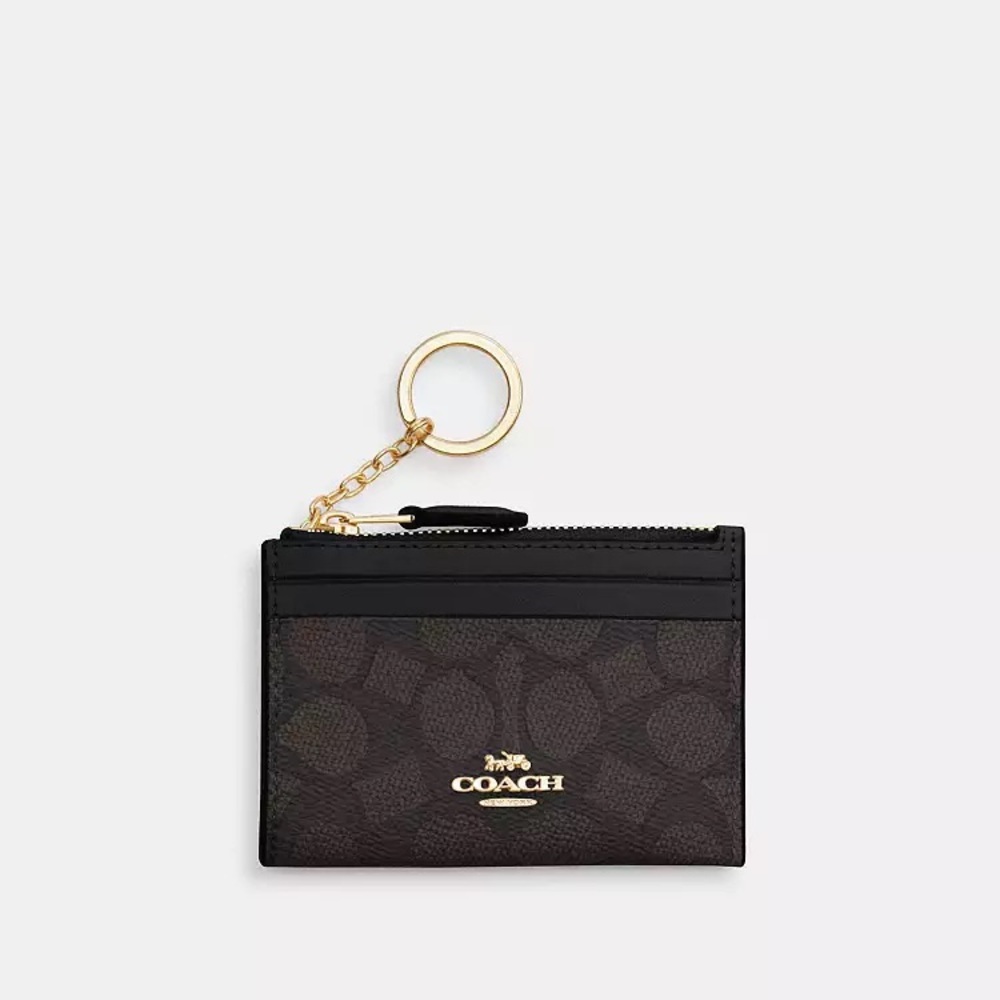 Coach Mini Skinny ID case in signature canvas.